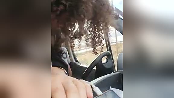 Curly girl fucking in a car